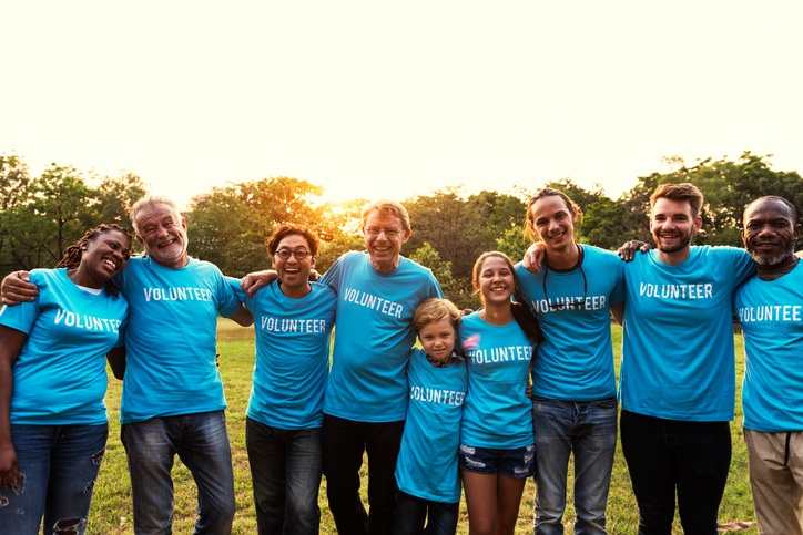 Volunteers Posing In T-Shirts