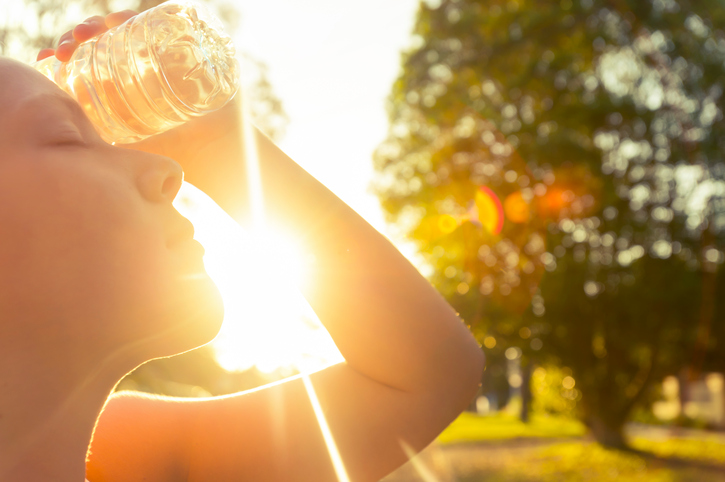 Woman Cooling Off In Sun